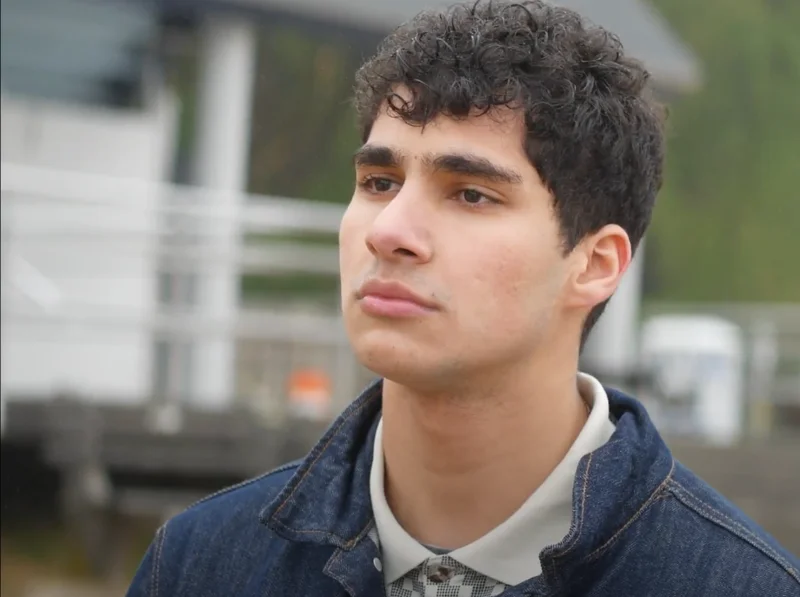 Tariq Kateeb in character holding helmet